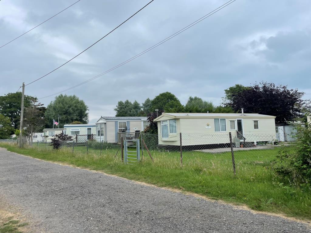 Lot: 143 - LAND WITH LICENCE FOR ELEVEN CARAVANS - Caravans